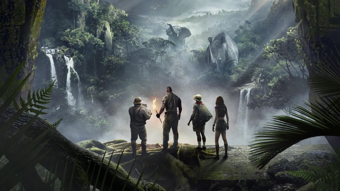Four adventurers in a jungle with elephants and rhinos