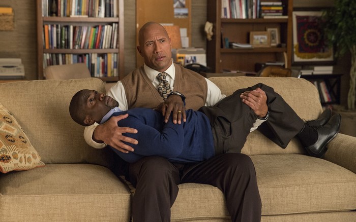 Kevin Hart and Dwayne Johnson sitting on a couch