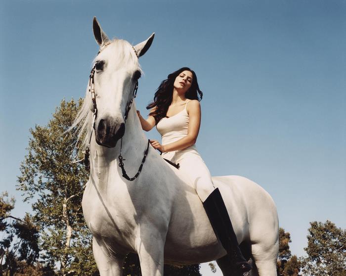 Katharine McPhee riding a white horse
