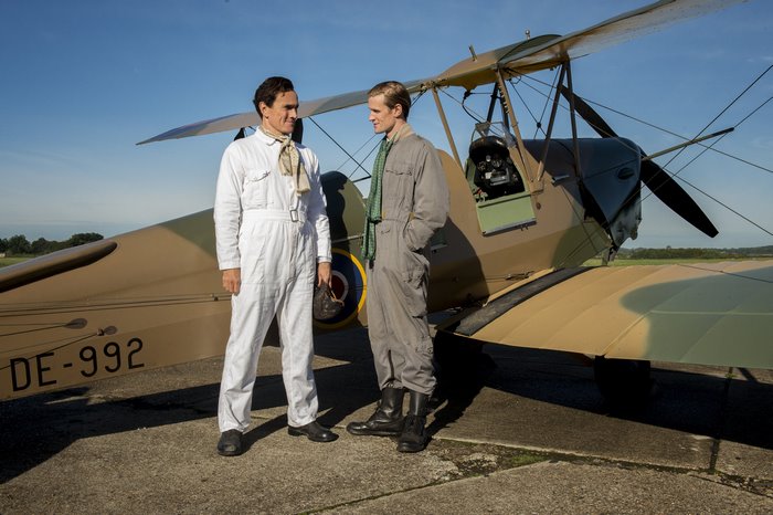 Matt Smith and another man by a biplane