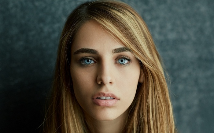 Close-up of a young woman with blue eyes