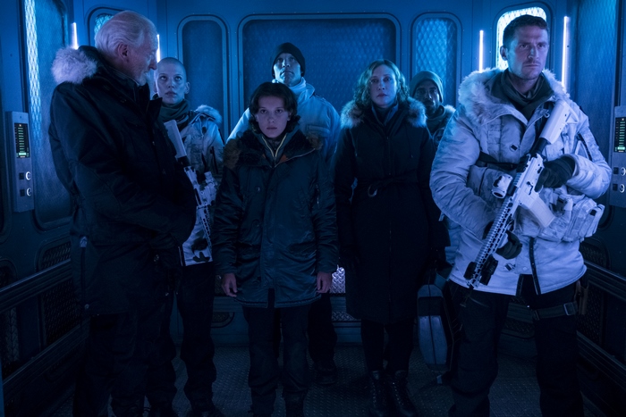 Millie Bobby Brown and group in a spaceship