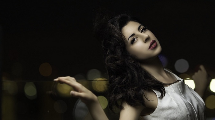 Woman posing with bokeh lights