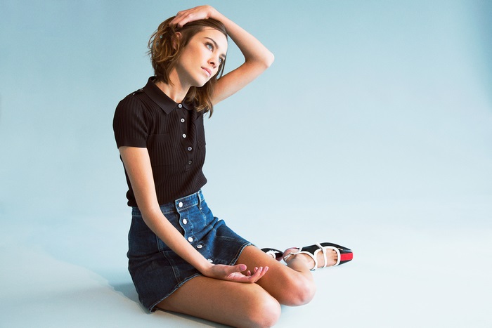 Alexa Chung sitting on the floor