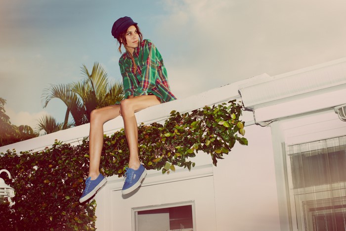 Alexa Chung sitting on a roof