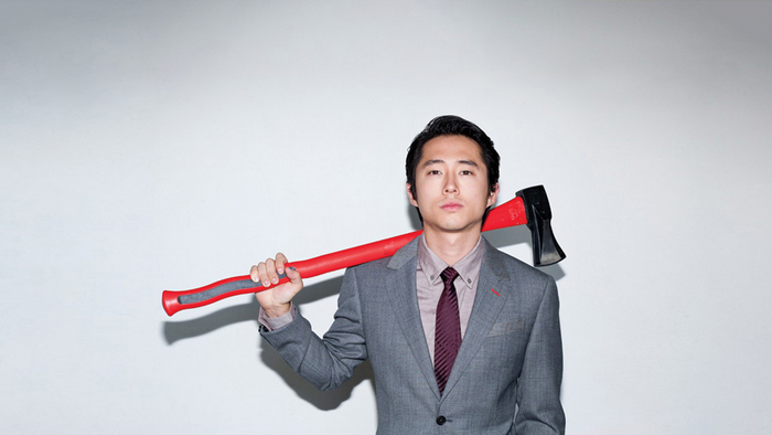 Steven Yeun with an axe