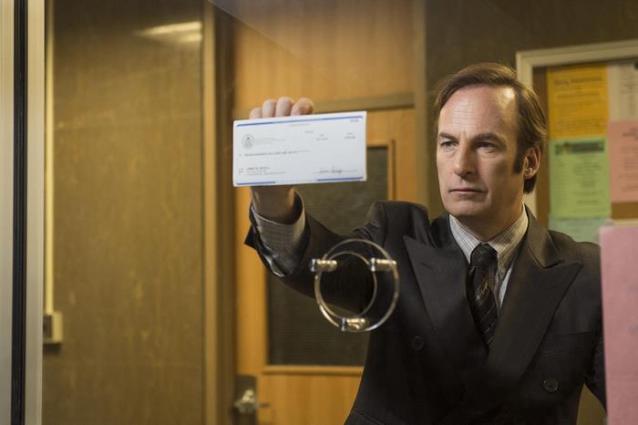 Bob Odenkirk holding a check
