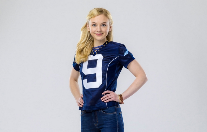 Emily Kinney in a blue football jersey