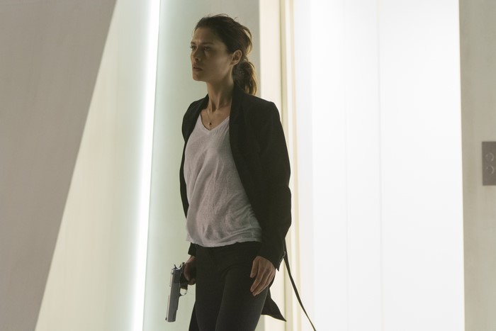 Hannah Ware holding a gun