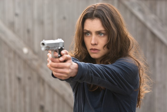 Hannah Ware holding a handgun