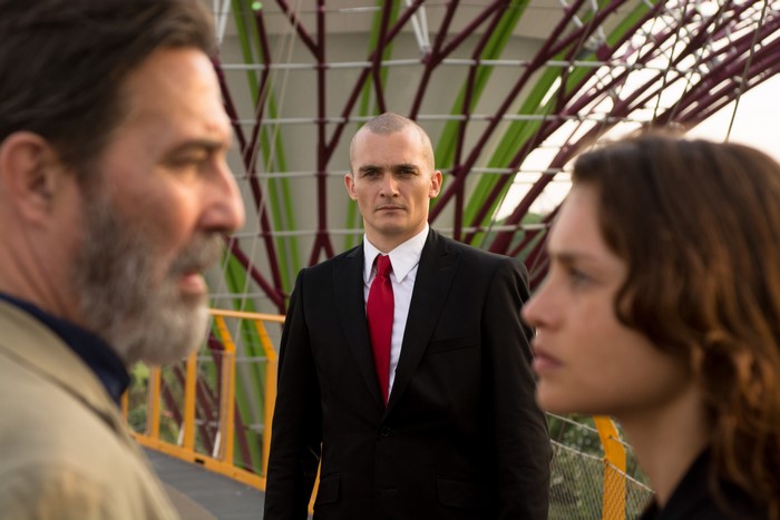 Hannah Ware and two men on a bridge