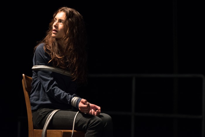 Hannah Ware tied to a chair