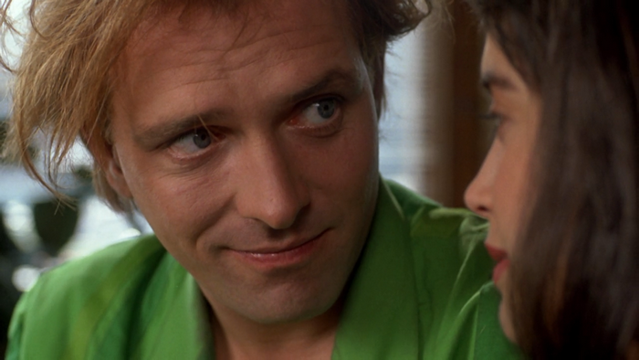 Rik Mayall in a green shirt