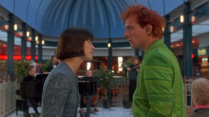 Rik Mayall and woman in mall