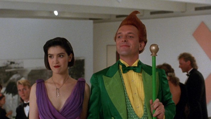 Rik Mayall in a green suit