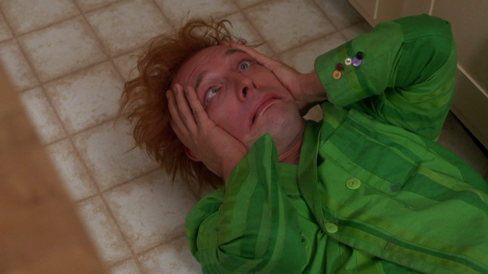 Rik Mayall lying on the floor