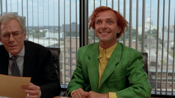 Rik Mayall in a green suit