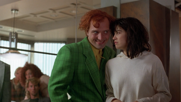 Rik Mayall with a woman