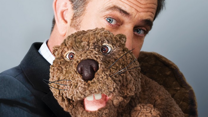 Mel Gibson with a beaver puppet