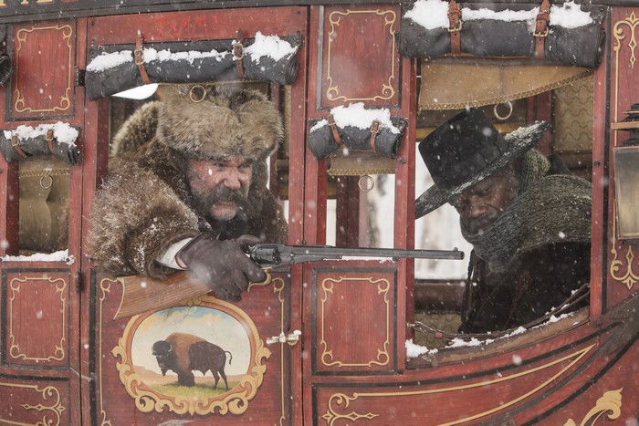 Kurt Russell and Samuel L. Jackson in a stagecoach