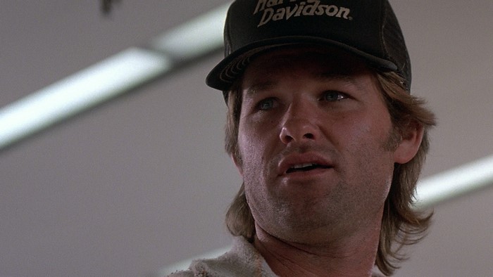 Kurt Russell wearing a Harley Davidson hat