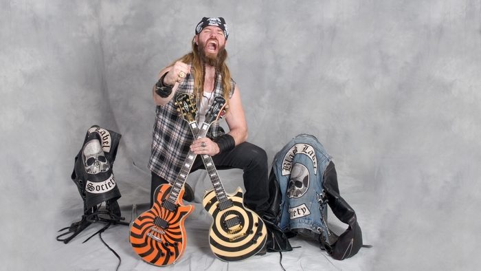 Zakk Wylde with guitars and vests