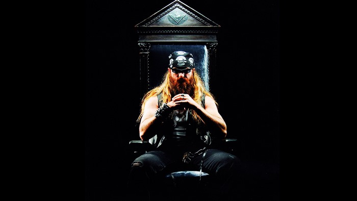 Zakk Wylde sitting on a throne