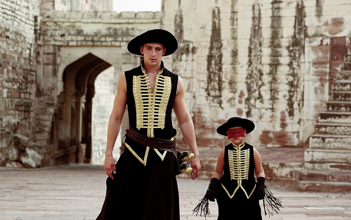 Lee Pace and child in ornate military-style outfits