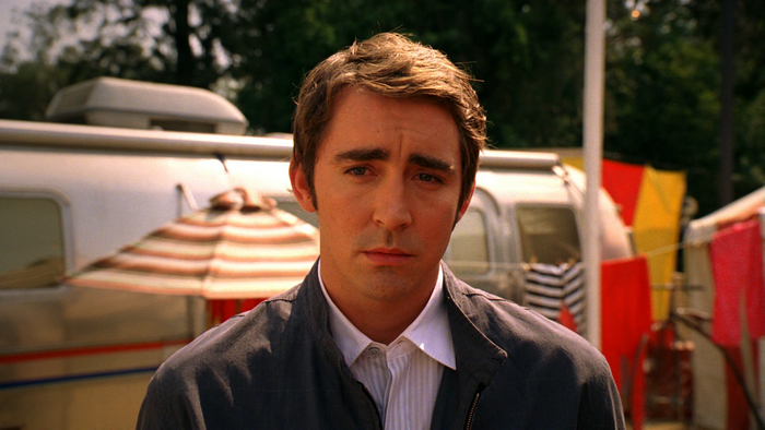 Lee Pace in front of a trailer
