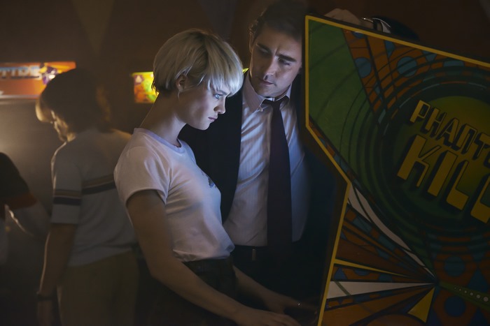 Lee Pace and woman playing arcade game