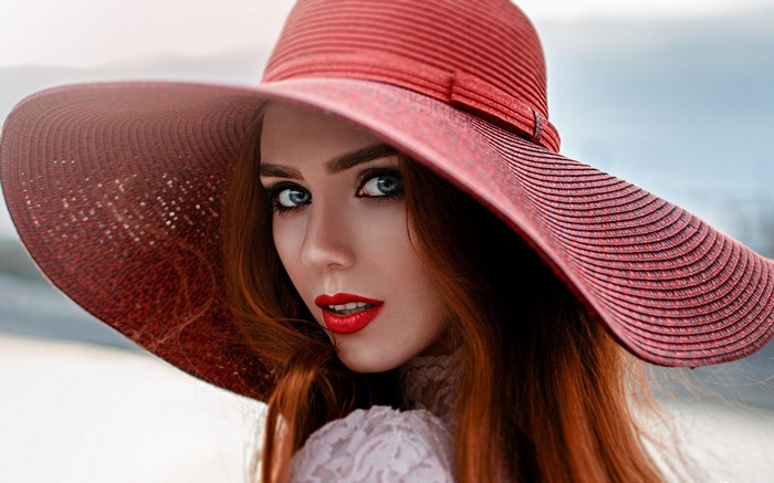 Woman in a red hat with red lipstick