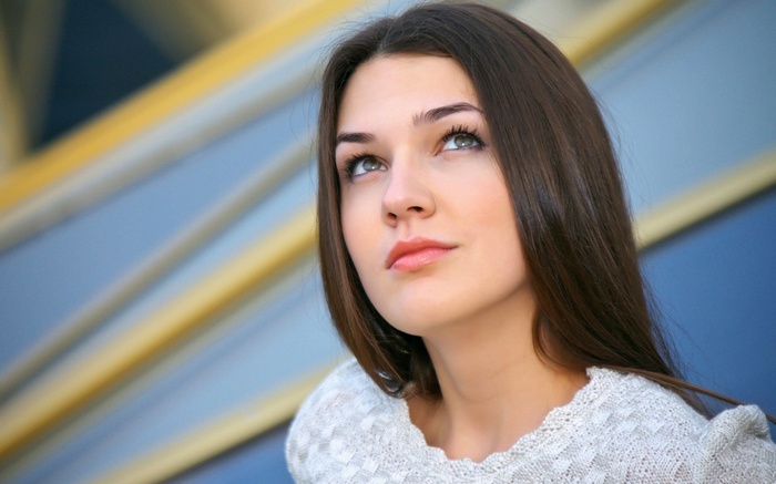 Young woman looking up