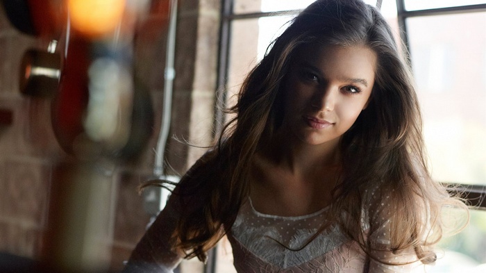 Hailee Steinfeld posing by a window