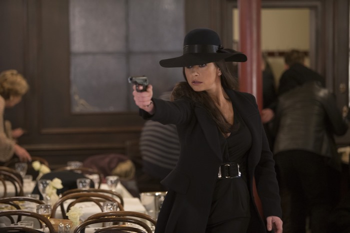 Catherine Zeta-Jones holding a gun