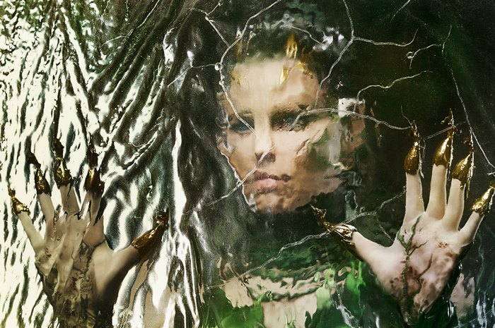 Elizabeth Banks behind a textured glass