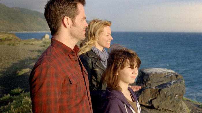 Elizabeth Banks and family by the ocean