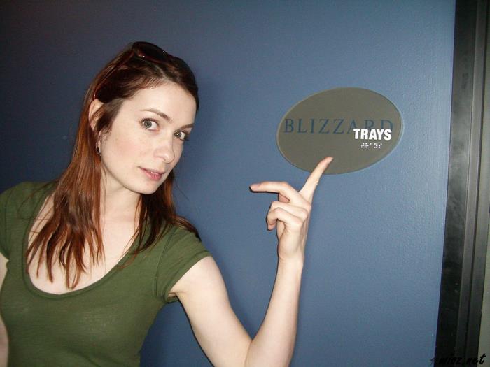 Felicia Day pointing at Blizzard Trays sign