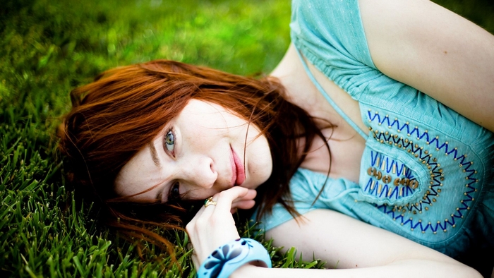 Felicia Day lying on grass