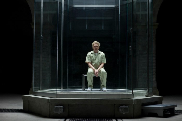 Javier Bardem in a glass enclosure