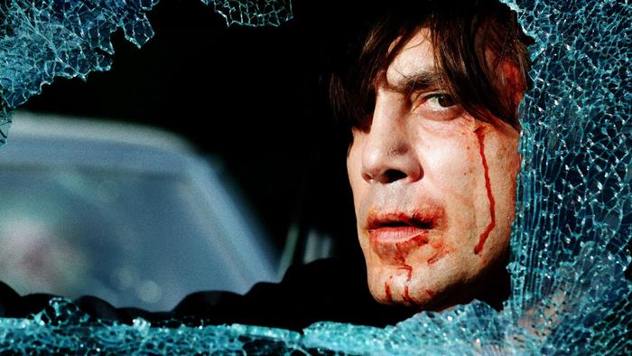 Javier Bardem through broken glass