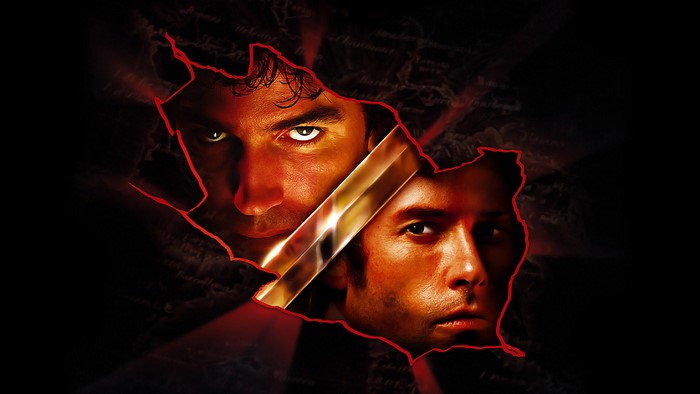 Jim Caviezel in a torn, dark background
