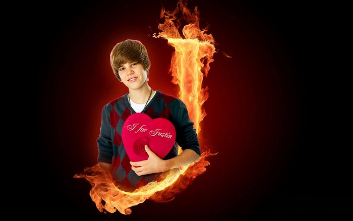 Justin Bieber holding a heart with flames