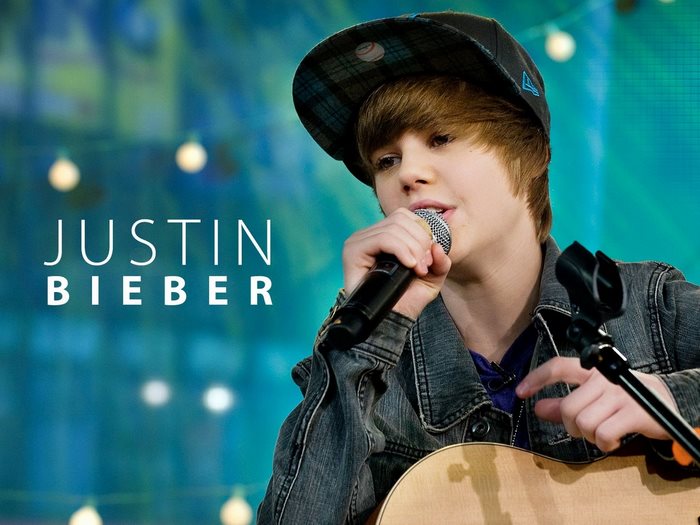 Justin Bieber singing with guitar