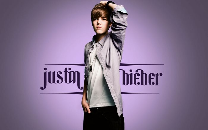 Justin Bieber Posing Against Purple Background