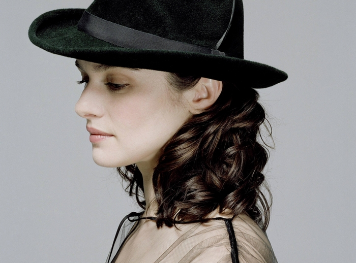 Rachel Weisz wearing a dark hat
