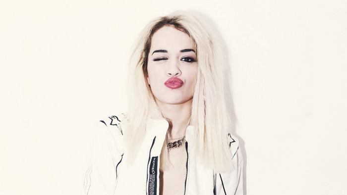 Rita Ora winks and pouts