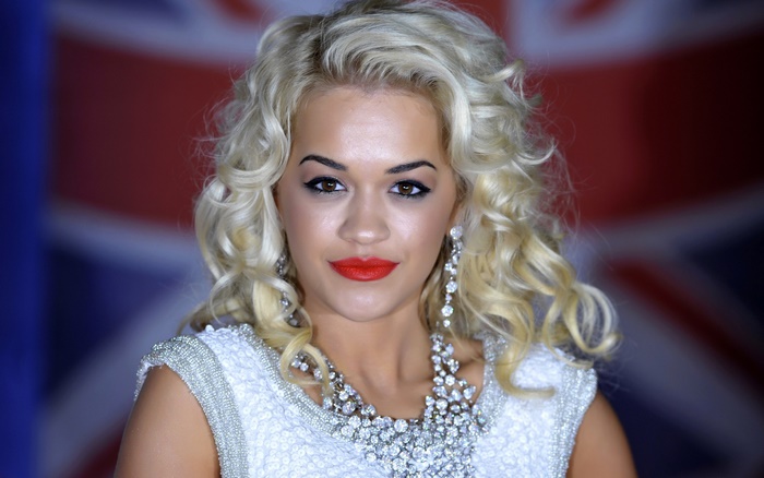Rita Ora in front of Union Jack
