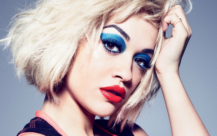 Rita Ora with blue eyeshadow and red lipstick