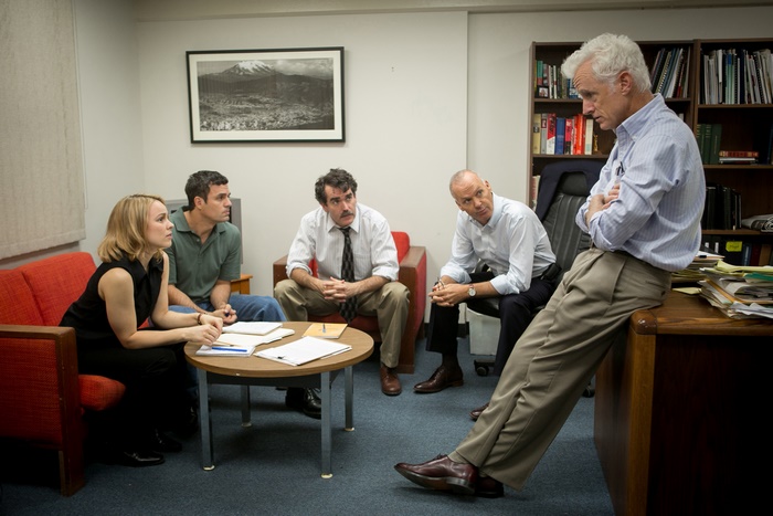 Michael Keaton and colleagues in an office meeting