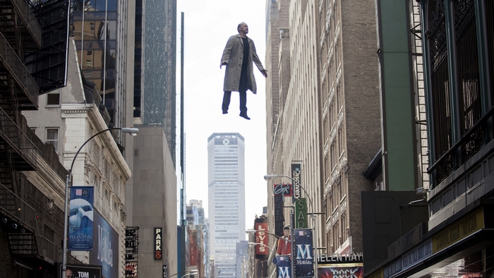 Michael Keaton flying between buildings